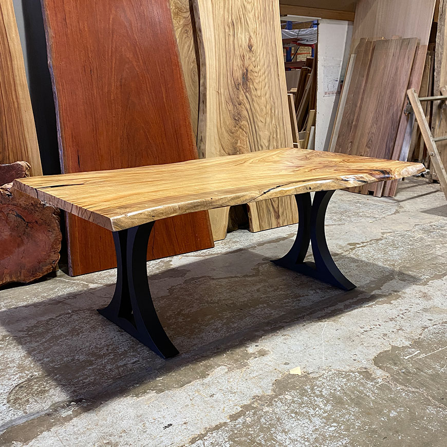 ARCO single slab dining table in Camphor Laurel